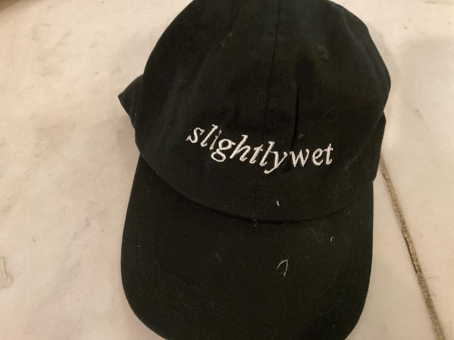 Cap black slightly wet